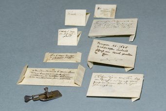 Original Leeuwenhoek microscope with eight original envelops with specimens that Antoni van Leeuwenhoek sent to the Royal Society in London between 1674 and 1687. The microscope is kept at Rijksmuseum Boerhaave in Leiden, the packets with specimens are from the archives of The Royal Society in London. Original Leeuwenhoek microscope with eight original envelops with specimens that Antoni van Leeuwenhoek sent to the Royal Society in London between 1674 and 1687. The microscope is kept at Rijksmuseum Boerhaave in Leiden, the packets with specimens are from the archives of The Royal Society in London.