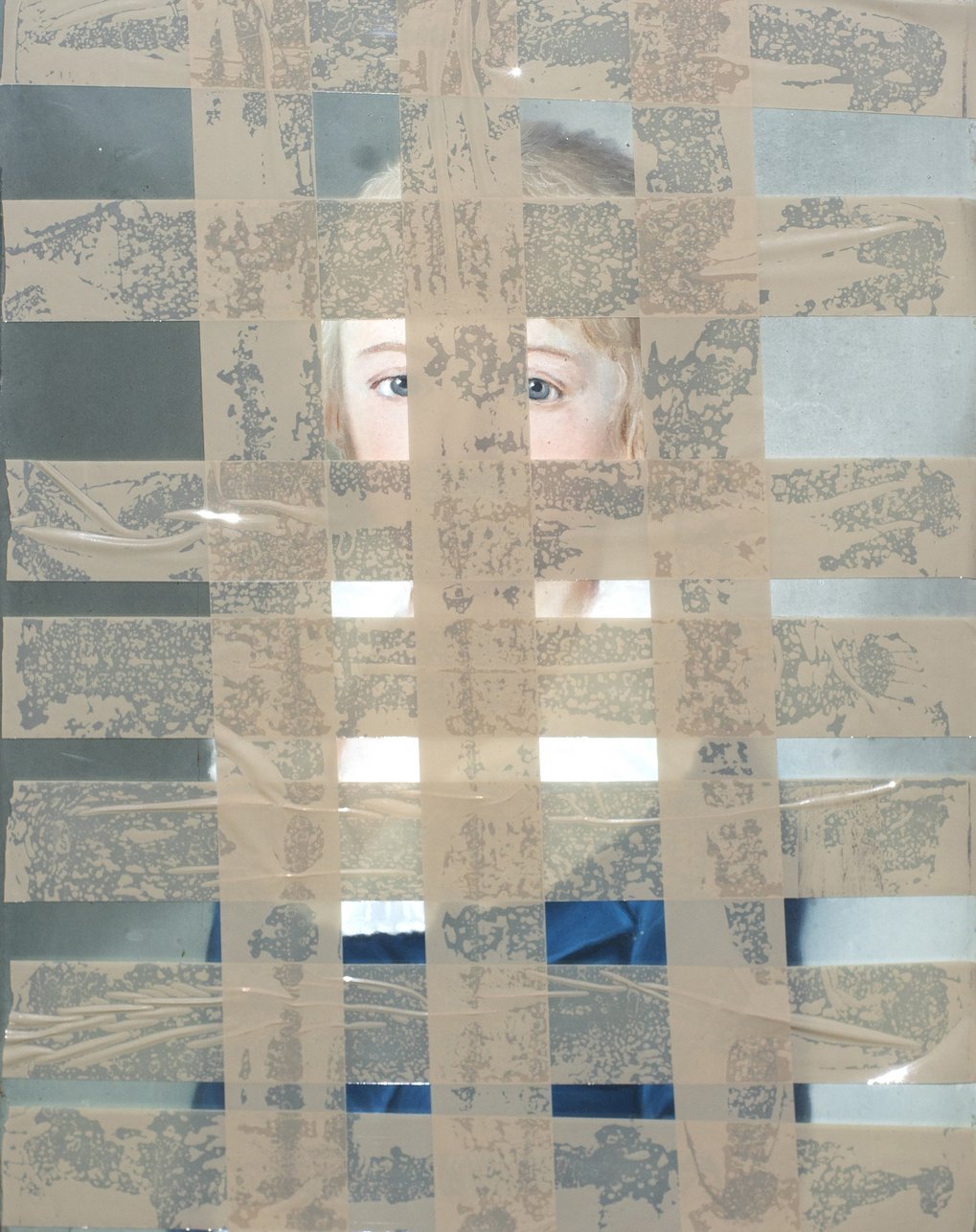 A checkerboard pattern of tape on glass with reflections, and a portrait behind.
