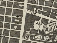 Historische Karte mit Straßennetz und markierten Gebäuden.